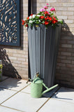 water butt planter with brass tap and watering can